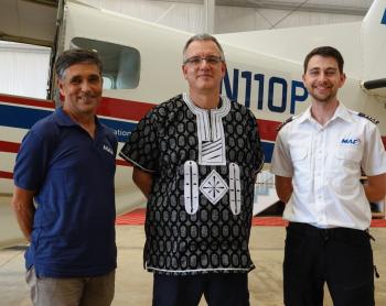 Leon, Ulrich and Ed celebrating Ulrich's last moment in Liberia
