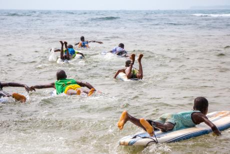 Young people hitting the waves