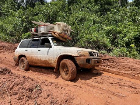 Joshua Nador travels on one of the worst roads in Liberia on the road to Harper.