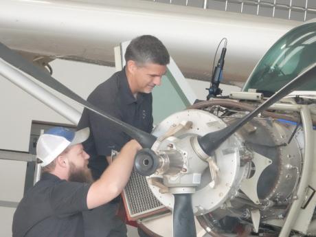 Brian Lewis and Joseph Sims two engineers from Samaritan’s Purse to work on a plane operated by MAF in neighbouring Guinea.